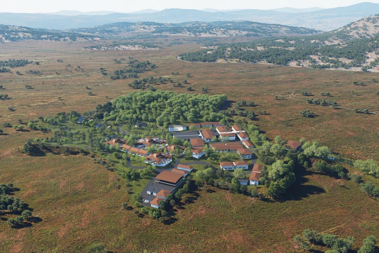 Artist impression of the new Unlimitd Unleashed. Aerial image showing several buildings in a rural location surrounded by hills.